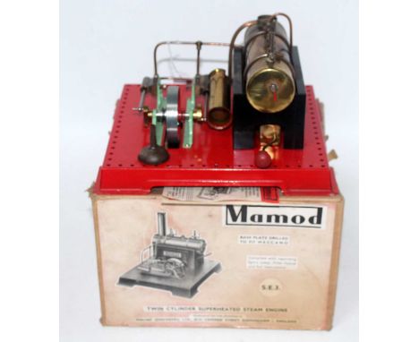 A Mamod SE1 twin cylinder super heated steam engine comprising of tin housed horizontal boiler with burner powering a twin cy