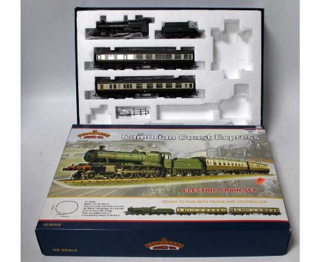 A Bachmann 'Cambrian Coast Express' train set box containing GWR 'Dunley Manor' engine and tender and two matching coaches on