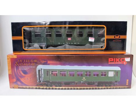 A train G scale bogie coach no. 757-5803 TB green (NM-BNM), together with a Piko no. 37653 green/cream DR bogie coach (NM-BNM