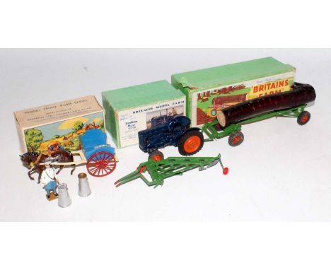 A collection of Britains boxed farming implements and loose farm accessories, to include a  No. 128F Fordson Major tractor, a