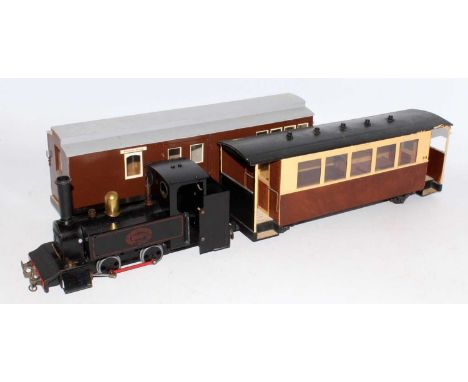 A narrow gauge 0-4-0 tank engine adapted from a Mamod locomotive and sold with a bogie coach and bogie brake van, both scratc
