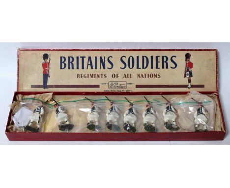 A Britains No. 196 The Evzones Royal Guards (Greek Army) comprising of eight various marching figures marching at the slope i