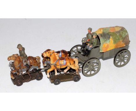 An Elastolin tinplate and composition model of a three horse drawn four-wheel covered army wagon with horse rider figure and 