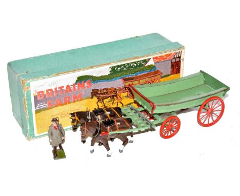 A Britains Home Farm series No. 5F farm wagon finished in light green with brown horses (possibly over painted) with carter f
