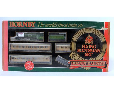 A Hornby Railways "Flying Scotsman" train set containing tender drive engine and tender, 3 x first series teak coaches, track