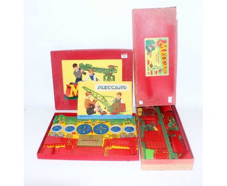 Two Meccano outfits: No. 4 light red/green, unused and an 8A box containing a quantity of same coloured spare parts