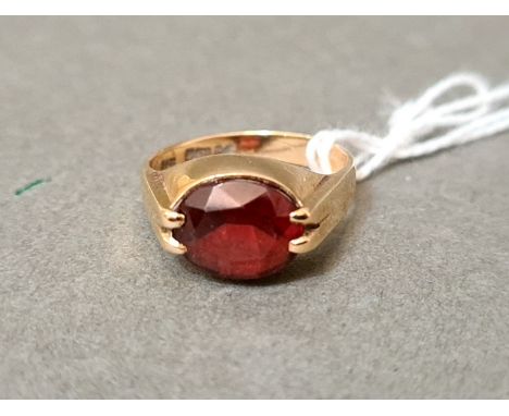 A hallmarked 9ct gold ring set with red paste, size M/N, gross wt. 3.55g. 