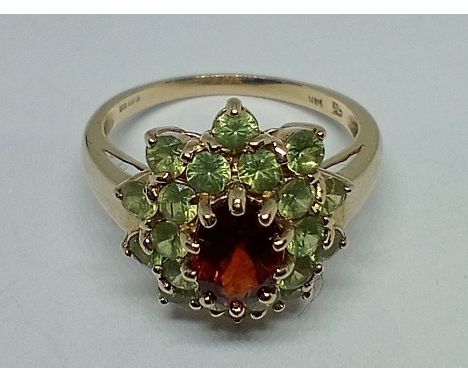A hallmarked 14ct gold spessartite and demantoid garnet ring, size R, gross wt. 4.2g. 