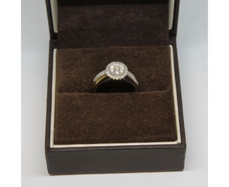A hallmarked 9ct gold diamond cluster ring, gross wt. 3.2g, size N. 