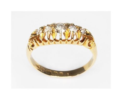 An Edwardian five stone diamond ring, the old European cut diamonds weighing approx. 0.24ct in total, hallmarked 18ct gold ba