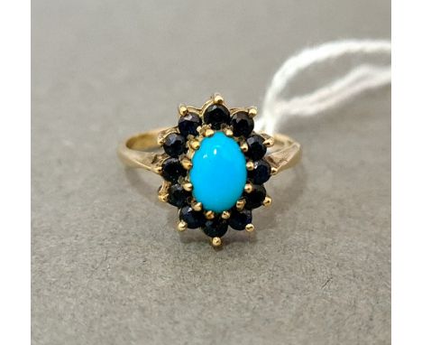 A hallmarked 9ct gold turquoise and sapphire ring, size M, gross wt. 2.4g. 