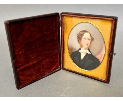 An antique miniature portrait of a gentleman in a fitted case with burgundy velour and glazed.Condition:- General wear throug
