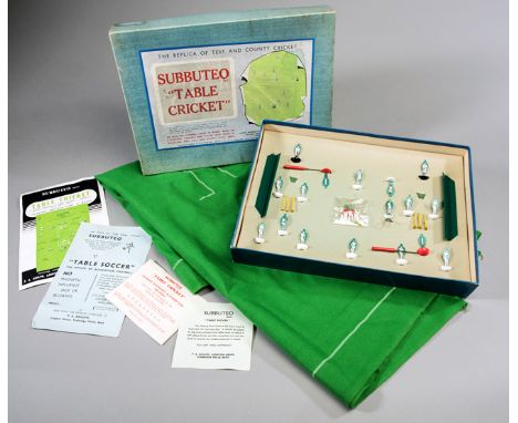 A 1950s boxed set of Subbuteo Table Cricket,
playing pitch, a pair of wickets, celluloid players set with prints, two backsto