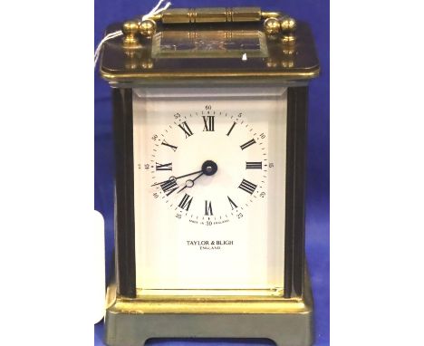 A Taylor and Bligh brass carriage clock with key, H: 11 cm, working at lotting. P&amp;P Group 3 (£25+VAT for the first lot an