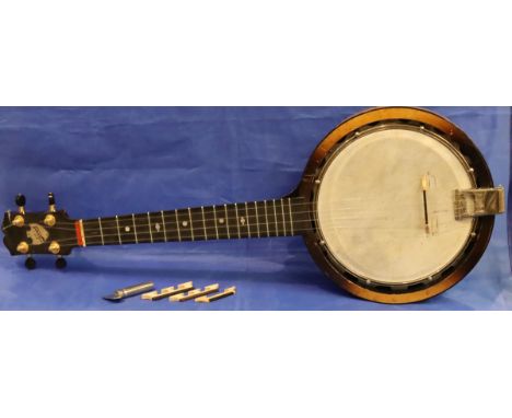 Cased four string Keech banjolele. P&amp;P Group 3 (£25+VAT for the first lot and £5+VAT for subsequent lots) 