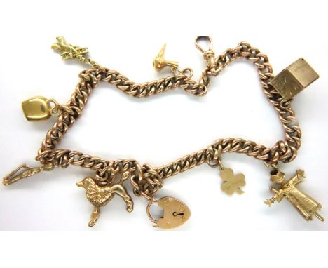 9ct gold bracelet with eight yellow metal charms, L: 32 cm, combined 30.1g. Some charms not hallmarked but presumed gold. P&a