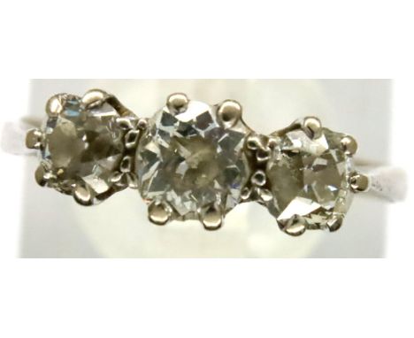 18ct white gold ring set with three diamonds, size Q/R, 3.3g. Shank slightly off circular and a little worn. Diamonds appear 