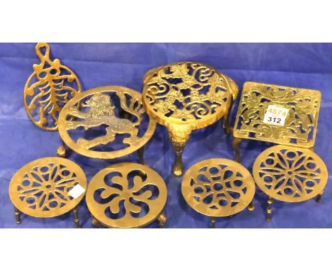 Eight 19th and 20th century brass trivets, largest D: 19 cm. P&amp;P Group 3 (£25+VAT for the first lot and £5+VAT for subseq