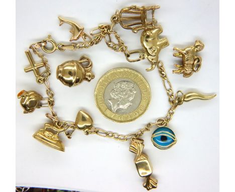 9ct gold charm bracelet with ten charms, 8.4g, chain broken. P&amp;P Group 1 (£14+VAT for the first lot and £1+VAT for subseq