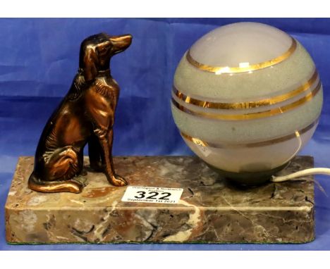 Art Deco type table lamp with rectangular marble plinth surmounted with a seated dog and a globular shade, L: 20 cm. Shade ha