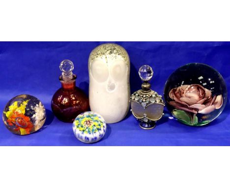 Four glass paperweights and two coloured glass perfume bottles. P&amp;P Group 3 (£25+VAT for the first lot and £5+VAT for sub