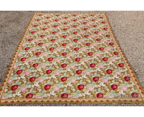 A very large 20th century hand woven tapestry, the ochre ground with pink and red roses, 300 x 424cm approx.