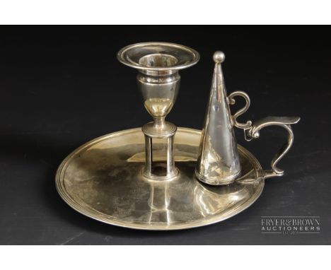 A silver William IV chamber stick and snuffer, circular base with reeded rim, makers mark HC for Henry Chawner, London 1830, 