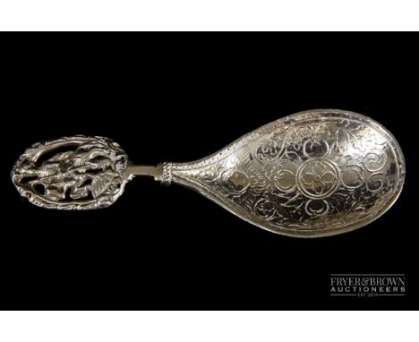 A Continental silver caddy spoon, the handle pierced with St George and the Dragon, stamped import marks, Chester 1904, 25grs