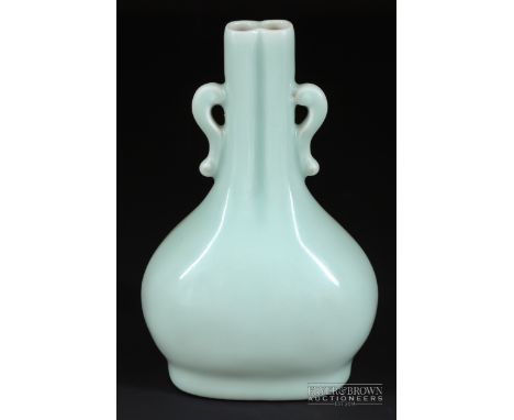 A Chinese monochrome Qingbai type glaze vase, Qianlong, the moulded vase of flattened pear shape with double barrel neck and 