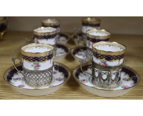A set of six Wedgwood coffee cans and saucers, with silver plated holders