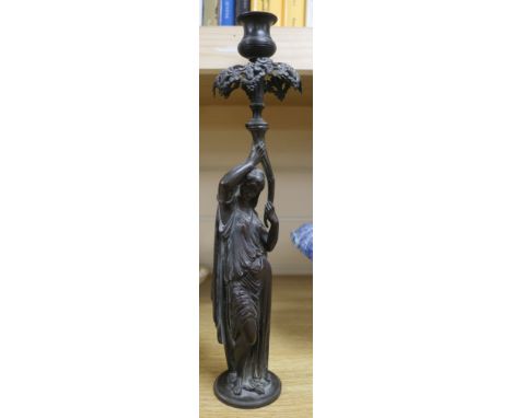 A figural candlestick