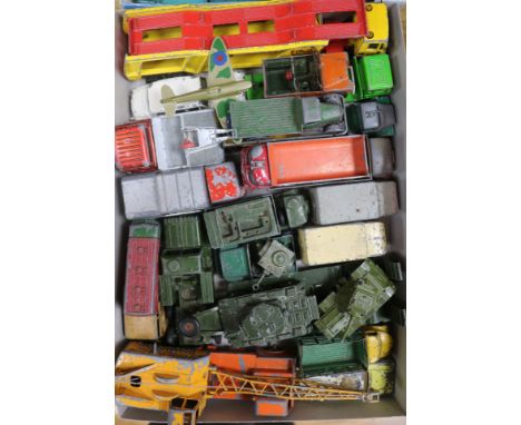 A collection of mostly Dinky and Matchbox commercial vehicles and military trucks, etc.