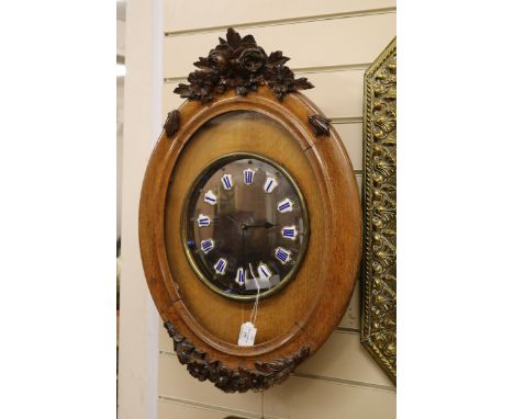 A French oak wall clock with quartz movement W.48cm