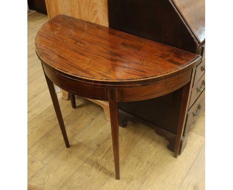 A George III mahogany demi-lune folding top card table W.91.5cm