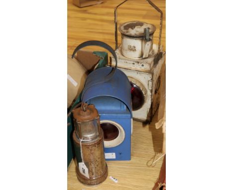 Two vintage road lamps and an Oldham miners lamp