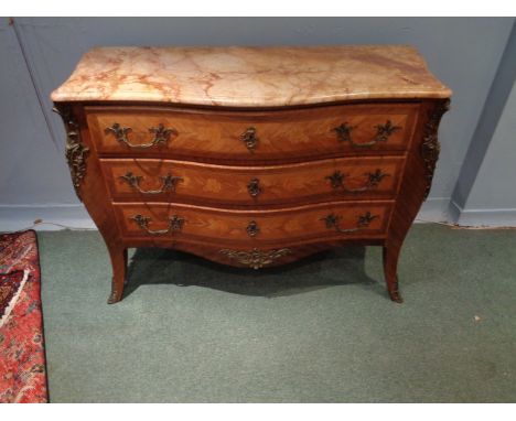 An early 20thC French Serpentine Commode with Gilt Metal Mounts with Biscuit Marble and 3 Long Drawers