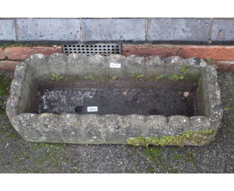A cast concrete low rectangular planter 