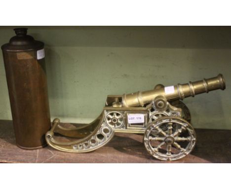 A cast brass model Canon, together with a copper cylinder water container 