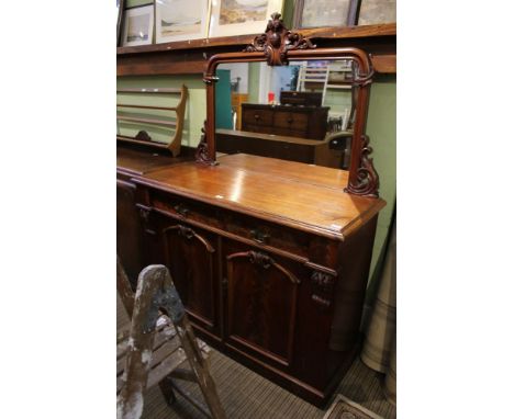 A 19th century mahogany chiffonier with framed mirrored upright, the plain retained the top having a single central drawer ov