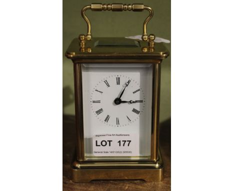 A plain brass carriage clock of typical form and construction 