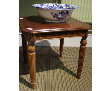 A reproduction square topped lamp type table on four reeded legs 