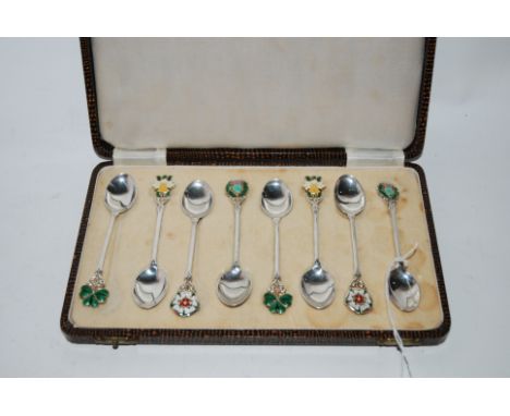 A cased set of eight silver coffee spoons with floral enamel terminals Birmingham 1961 Condition Report: All good.