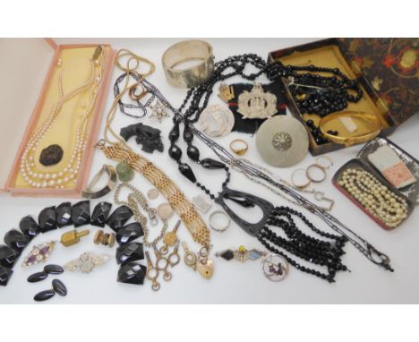 A rolled gold buckle shaped bangle, a silver Charles Horner three thistle brooch (af), a Kings Own Scottish Borderers badge a