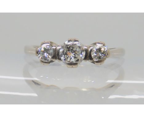 A white metal three stone diamond ring, set with estimated approx 0.40cts of brilliant cut diamonds, finger size P, weight 3.
