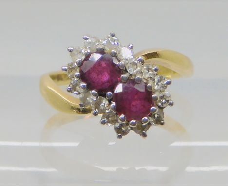 An 18ct gold ruby and diamond ring size J1/2, weight 3.7gms Condition Report: Has a full UK hallmark, the 750 is only just vi