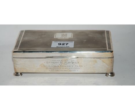 A silver cigarette box Birmingham 1938 17cm x 8.5cm x 5cm monogrammed "M" inscribed " Presented to George Macara by Kilmalcol