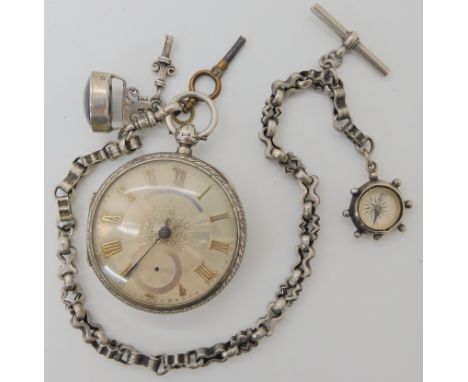 A silver John Forrest open face pocket watch, hallmarked Chester 1907, with fancy white metal chain, compass, fob seal and tw