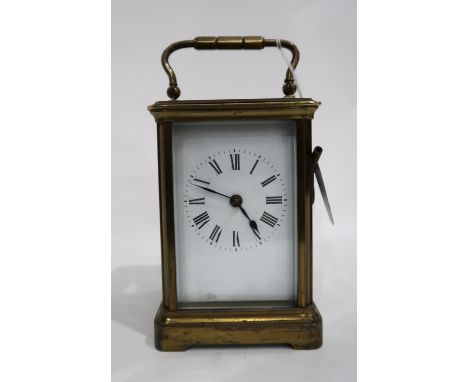 A brass and glass carriage clock in travel case, with key Provenance: The Late Dr Helen. E. C. Cargill Thompson Condition Rep