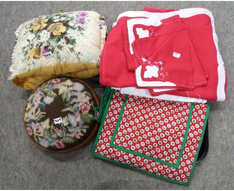 A circular tapestry footstool, a tea cosy, and assorted table covers Condition Report: Not available for this lot