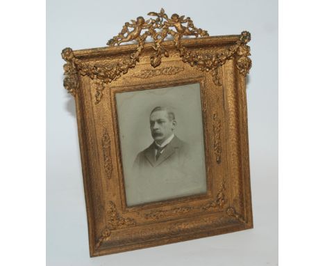 A gilt-metal photograph frame with easel stand, 24 x 20cm, an early silhouette and various daguerreotypes` Provenance: The La